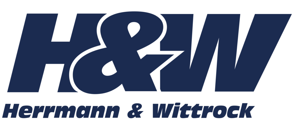Logo for Herrmann & Wittrock: large navy H&W with 'Herrmann & Wittrock' below in bold.